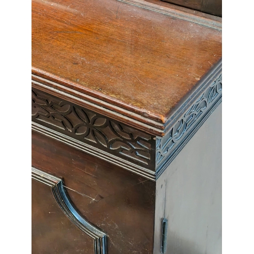 216 - A late 19th century mahogany library bookcase. The bookcase having a pediment top with blind fret wo... 