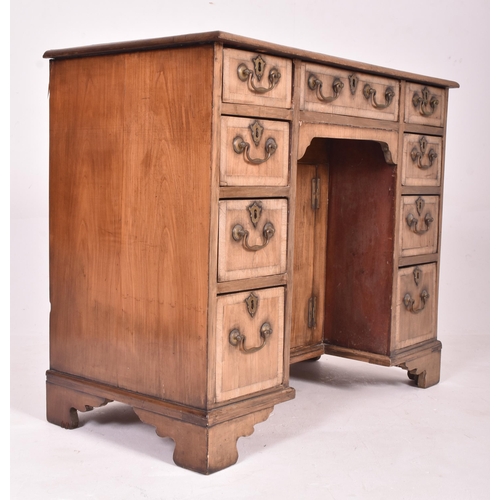 221 - A George III late 18th century mahogany kneehole writing desk. The desk having a rectangular top ove... 