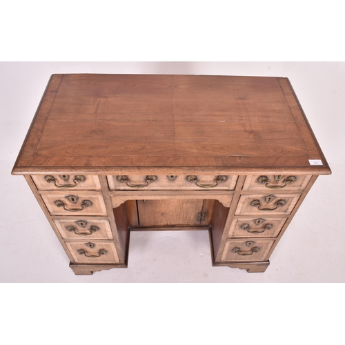 221 - A George III late 18th century mahogany kneehole writing desk. The desk having a rectangular top ove... 