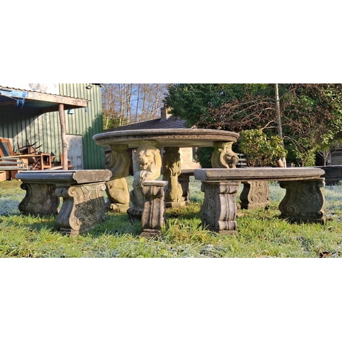 234 - A large 20th century composite stone circular garden outdoor table with curved benches. The table ra... 