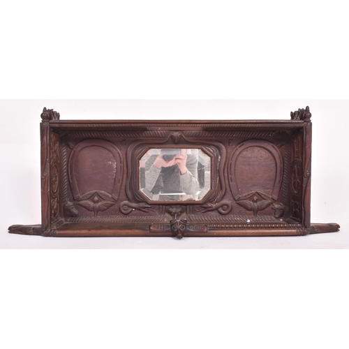 235 - An Edwardian early 20th century 1903 carved ebonised wood hanging cupboard shlef with mirror. The sh... 