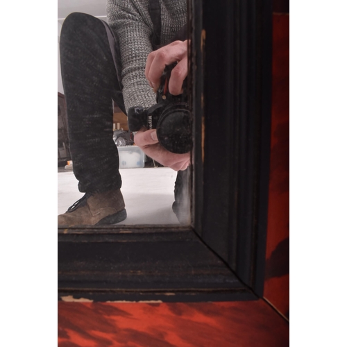 239 - A 19th century Victorian painted faux tortoiseshell hanging overmantel wall mirror. The mirror of re... 