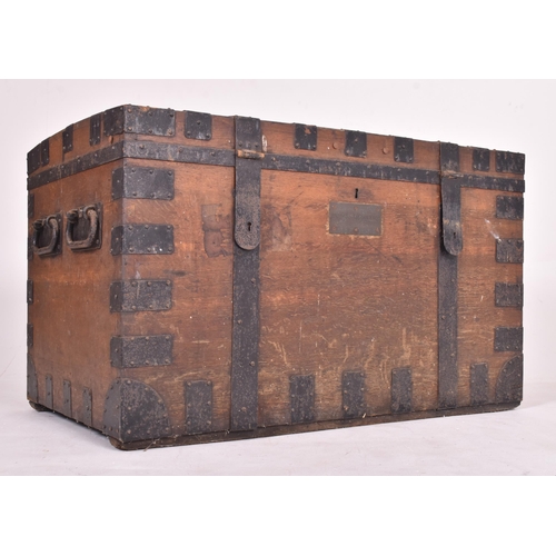 240 - A large 19th century Victorian oak & iron bound  campaign travel trunk chest. The trunk having a... 