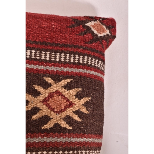 244 - A collection of country house matched set of seven late 20th-century Kilim carpet squab cushions. Si... 