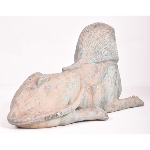 245 - A pair of large 20th century hollow cast bronze garden Egyptian sphinxes. Of hollow cast bronze cons... 