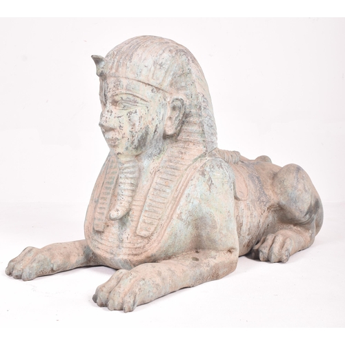 245 - A pair of large 20th century hollow cast bronze garden Egyptian sphinxes. Of hollow cast bronze cons... 