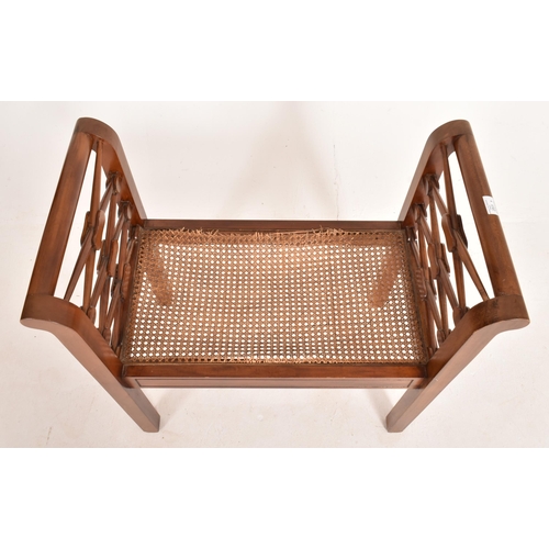 251 - An early 20th century, Edwardian mahogany and rattan weave seat window seat bench. The bench having ... 