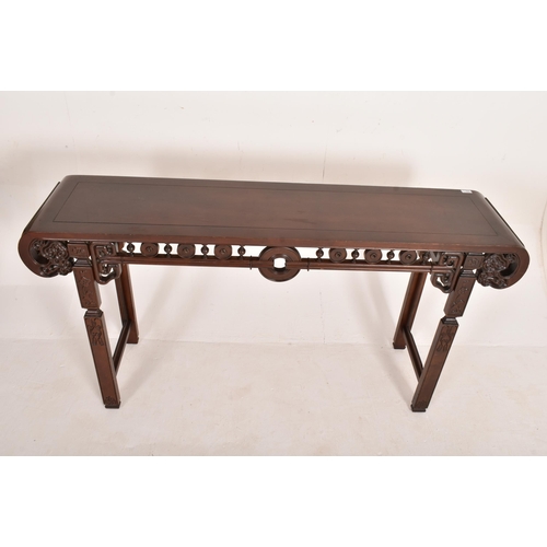 252 - A Chinese 20th century carved hardwood altar console table. The table having a rectangular top with ... 