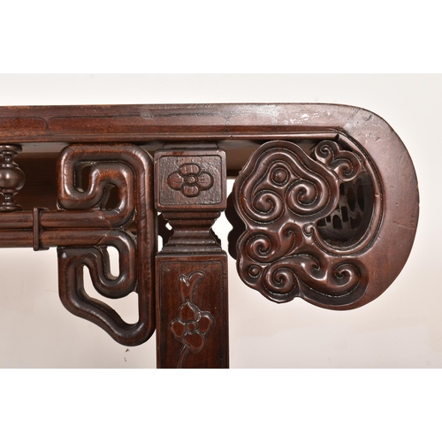 252 - A Chinese 20th century carved hardwood altar console table. The table having a rectangular top with ... 