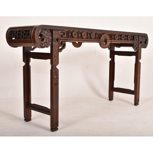 252 - A Chinese 20th century carved hardwood altar console table. The table having a rectangular top with ... 