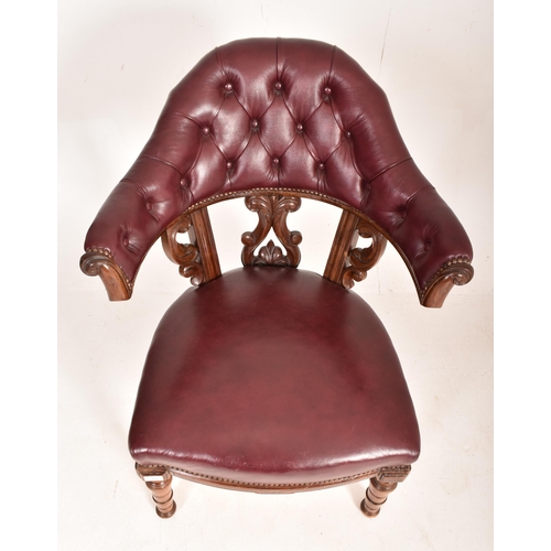 262 - A Victorian 19th century mahogany framed & leather cockfighting armchair. The chair having a cur... 