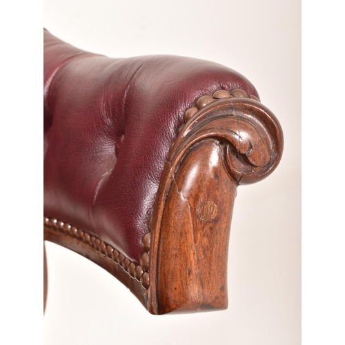 262 - A Victorian 19th century mahogany framed & leather cockfighting armchair. The chair having a cur... 