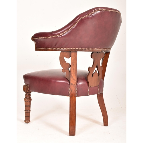 262 - A Victorian 19th century mahogany framed & leather cockfighting armchair. The chair having a cur... 