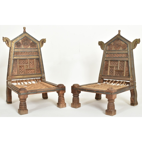 265 - A pair of early 20th century traditional Indian / Punjabi marriage chairs. Each chair with shaped ca... 