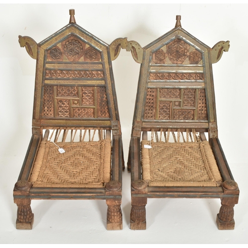 265 - A pair of early 20th century traditional Indian / Punjabi marriage chairs. Each chair with shaped ca... 