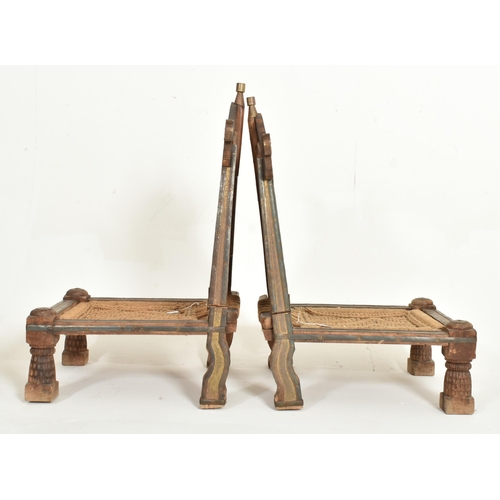 265 - A pair of early 20th century traditional Indian / Punjabi marriage chairs. Each chair with shaped ca... 