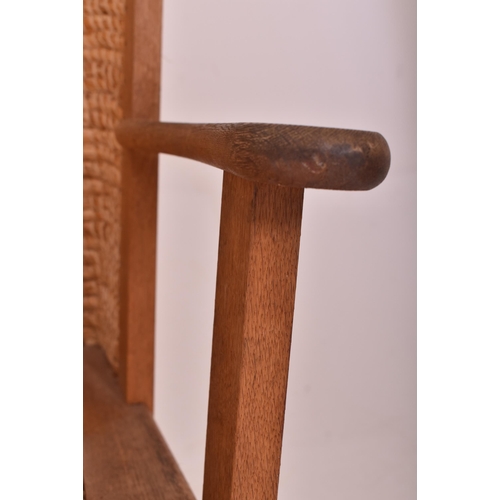 266 - A Scottish Orkney Highland early 20th century oak & seagrass woven rush back chair. The armchair... 