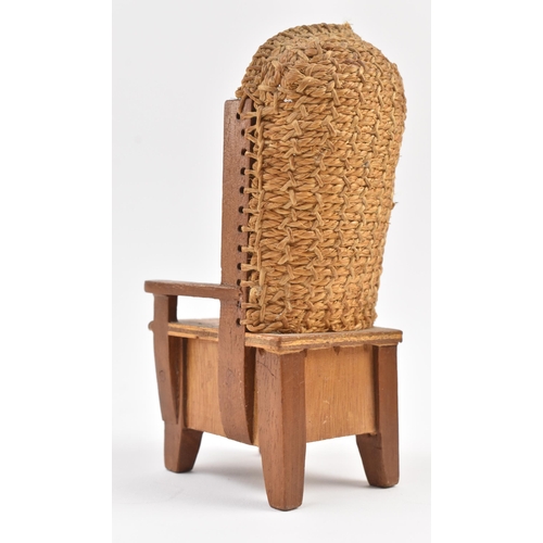 268 - A Scottish Orkney Highland oak & woven rush back miniature / salesman chair. The armchair having... 