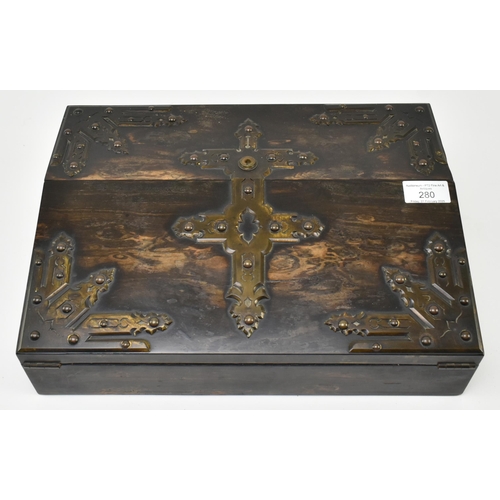 280 - A 19th century Victorian coromandel brass mounted Gothic revival writing slope box. The writing slop... 