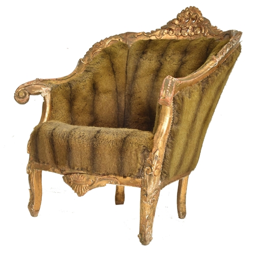 281 - A French 19th century giltwood & faux fur upholstered Provincial fauteiul bergere armchair. The ... 