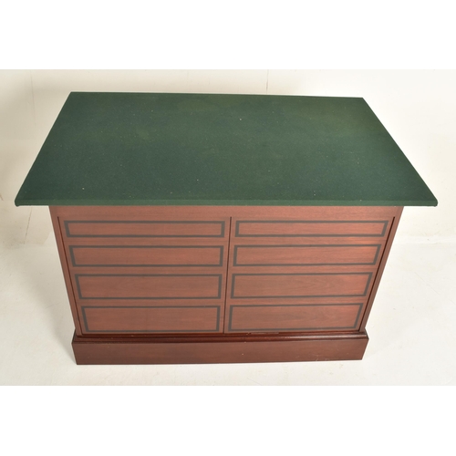 292 - A near pair of contemporary bespoke made mahogany office furnishings comprises an eight-drawer chest... 