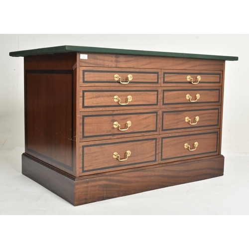 292 - A near pair of contemporary bespoke made mahogany office furnishings comprises an eight-drawer chest... 