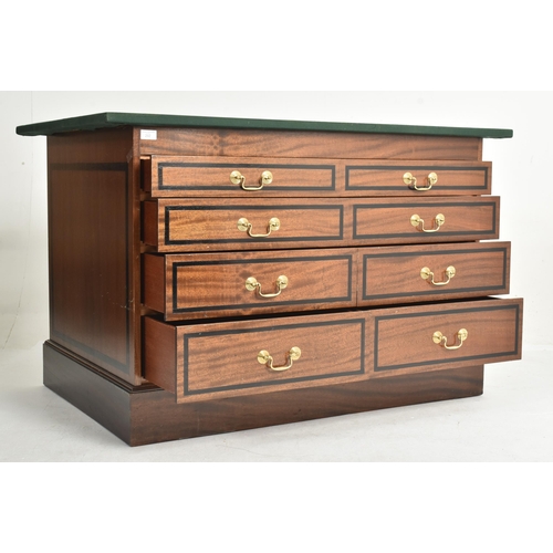 292 - A near pair of contemporary bespoke made mahogany office furnishings comprises an eight-drawer chest... 