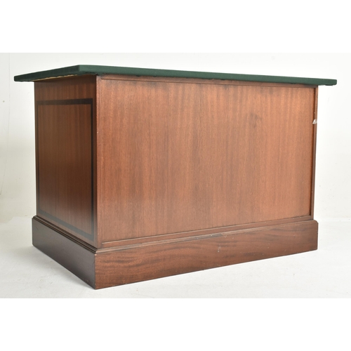 292 - A near pair of contemporary bespoke made mahogany office furnishings comprises an eight-drawer chest... 