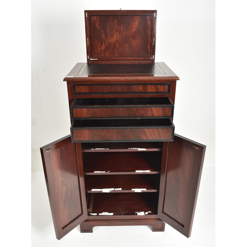 294 - A contemporary bespoke-made mahogany upright pedestal cupboard / chest. Tooled leather top with a li... 