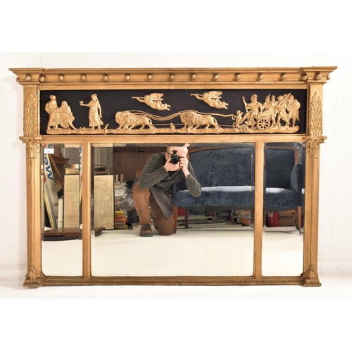 296 - A Regency 19th century gilt wood and gesso triptych overmantel wall mirror. The mirror having a flar... 