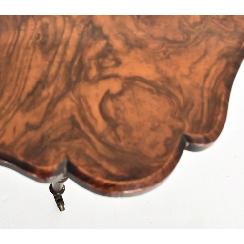 299 - A high Victorian 19th century figured walnut Sutherland drop leaf table. The table having a shaped c... 