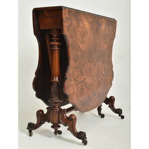 299 - A high Victorian 19th century figured walnut Sutherland drop leaf table. The table having a shaped c... 