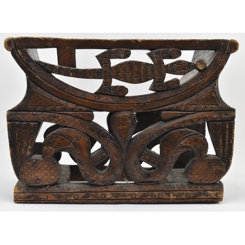 300 - An early 20th century African tribal wooden carved fruitwood stool chair. The chair with pierced bac... 