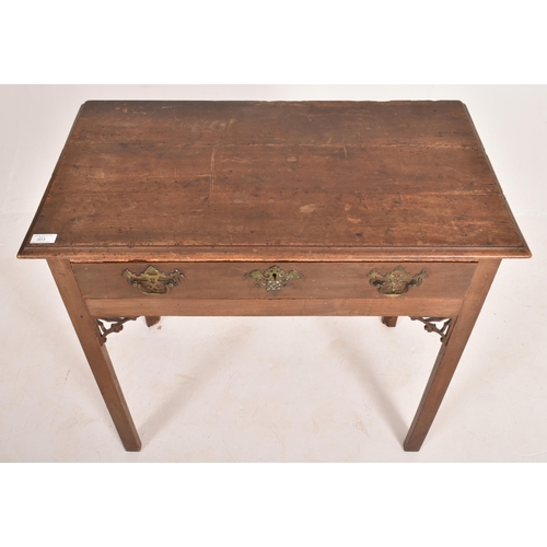 303 - A George III late 18th century walnut writing table desk. The table having a flared rectangular top ... 