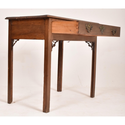 303 - A George III late 18th century walnut writing table desk. The table having a flared rectangular top ... 