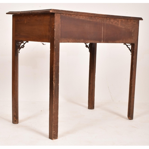 303 - A George III late 18th century walnut writing table desk. The table having a flared rectangular top ... 