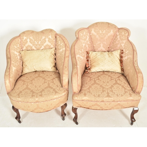 307 - A near matched pair of Queen Anne Revival early 20th century upholstered armchairs. Each having a pa... 