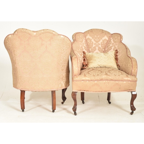 307 - A near matched pair of Queen Anne Revival early 20th century upholstered armchairs. Each having a pa... 