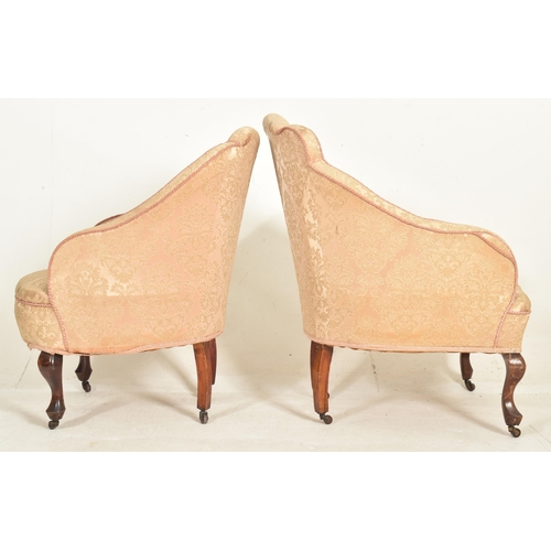 307 - A near matched pair of Queen Anne Revival early 20th century upholstered armchairs. Each having a pa... 