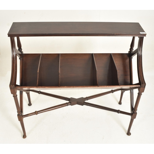 312 - An Edwardian solid mahogany book trough table stand. The table having a rectangular top above a five... 