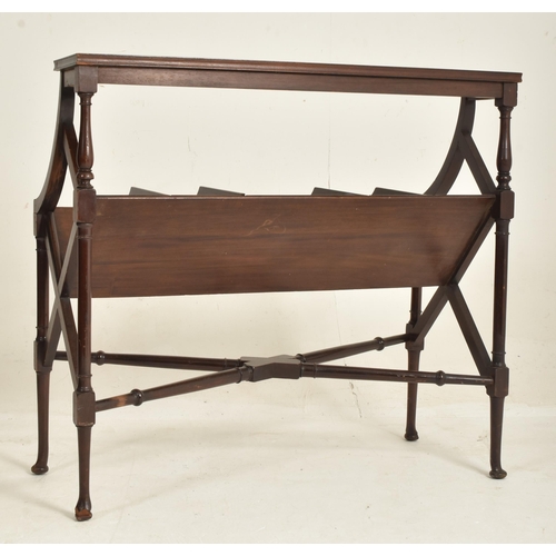 312 - An Edwardian solid mahogany book trough table stand. The table having a rectangular top above a five... 