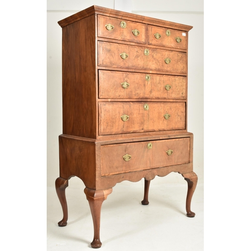 322 - An 18th century Queen Anne walnut chest of drawers on stand. The chest of drawers having a configura... 