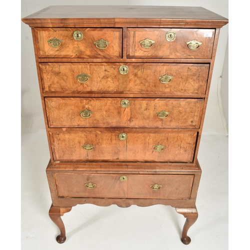 322 - An 18th century Queen Anne walnut chest of drawers on stand. The chest of drawers having a configura... 