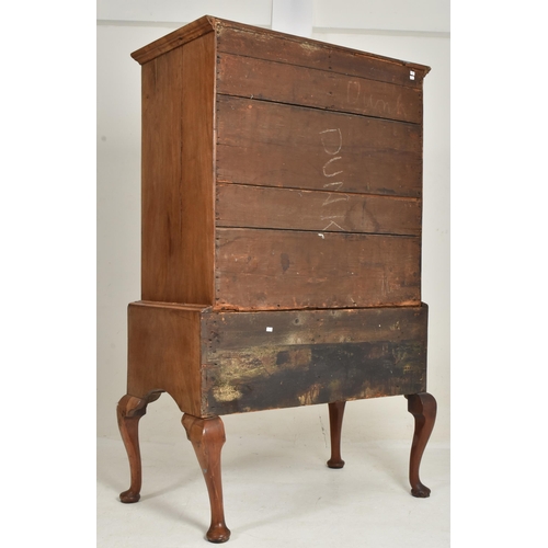 322 - An 18th century Queen Anne walnut chest of drawers on stand. The chest of drawers having a configura... 