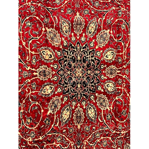 323 - A large early 20th century North West Persian Islamic Sarouk floor carpet rug. The rug having a cent... 