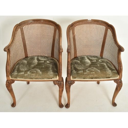 328 - A pair of Queen Anne Revival early 20th century circa 1930s walnut & cane worked Bergere library... 