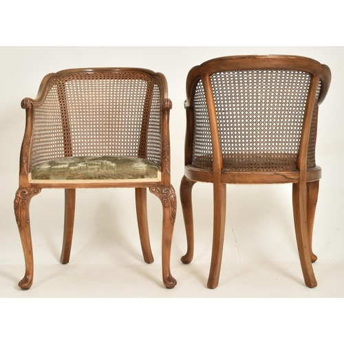 328 - A pair of Queen Anne Revival early 20th century circa 1930s walnut & cane worked Bergere library... 