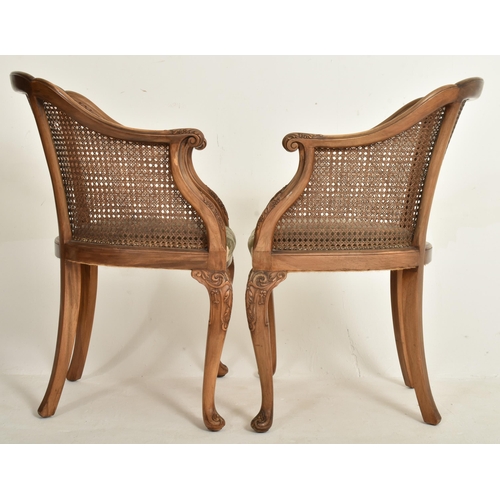 328 - A pair of Queen Anne Revival early 20th century circa 1930s walnut & cane worked Bergere library... 