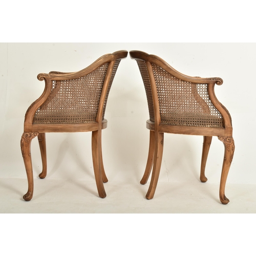 328 - A pair of Queen Anne Revival early 20th century circa 1930s walnut & cane worked Bergere library... 