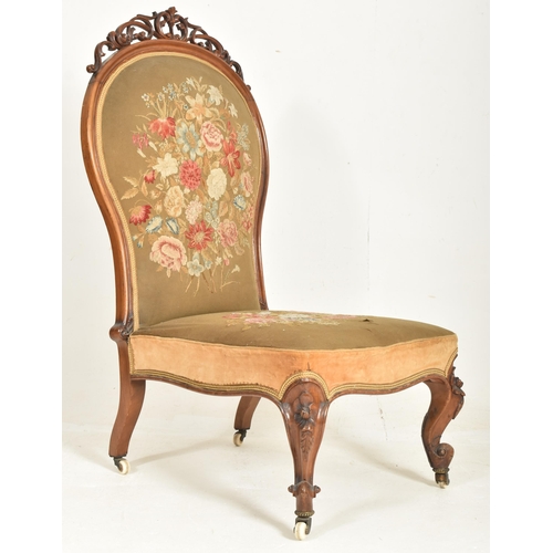 329 - An oversized 19th century mahogany farmed & needlepoint upholstered lady's armchair. The chair h... 